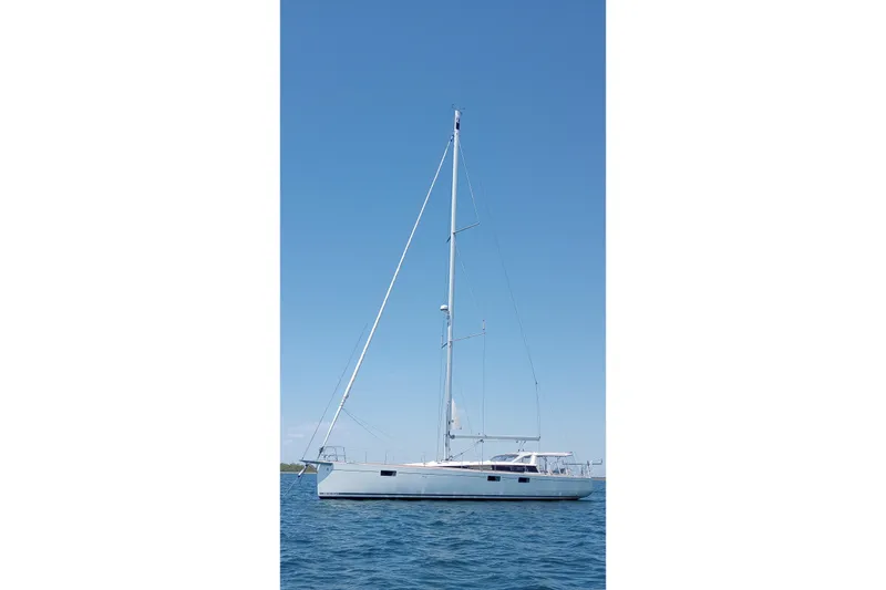 Slide: The Image of 2017 Beneteau Sense 50 sailboat on calm blue water under clear sky. - 3