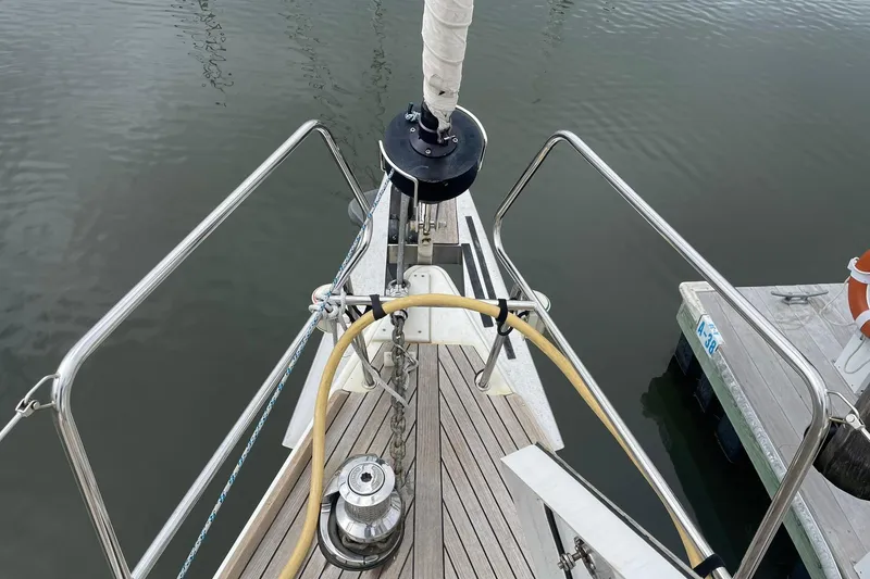 Slide: The Image of Bow of 2017 Beneteau Sense 50 yacht with deck equipment and railing. - 39