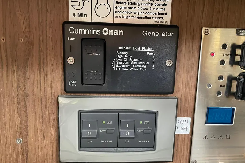 Slide: The Image of Control panel of a 2017 Beneteau Sense 50 yacht with Cummins Onan generator. - 45