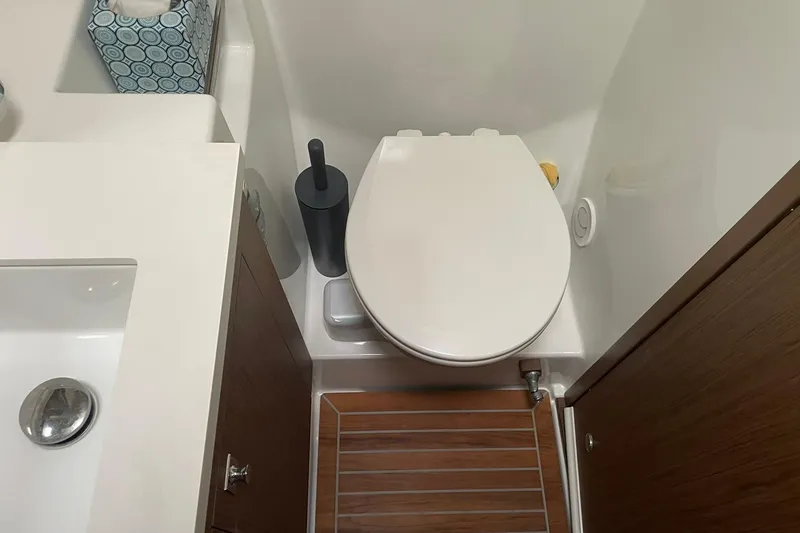 Slide: The Image of Bathroom interior of 2017 Beneteau Sense 50 yacht, featuring toilet and sink. - 61