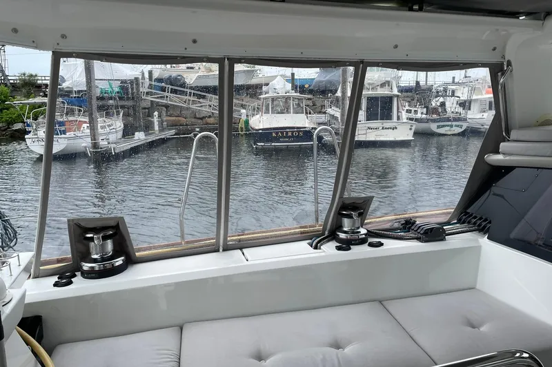 Slide: The Image of Interior view of 2017 Beneteau Sense 57 yacht with marina backdrop. - 86