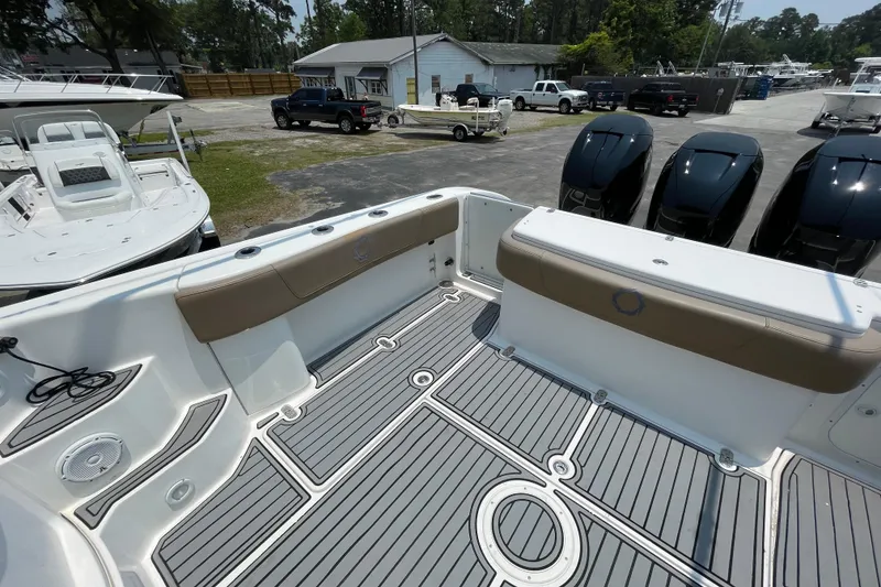 Slide: The Image of 2007 Fountain 38 Sportfish Cruiser OB boat interior with seating and outboard motors. - 12