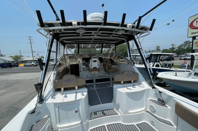 Slide: The Image of 2007 Fountain 38 Sportfish Cruiser OB, spacious deck, modern design, parked at marina. - 13