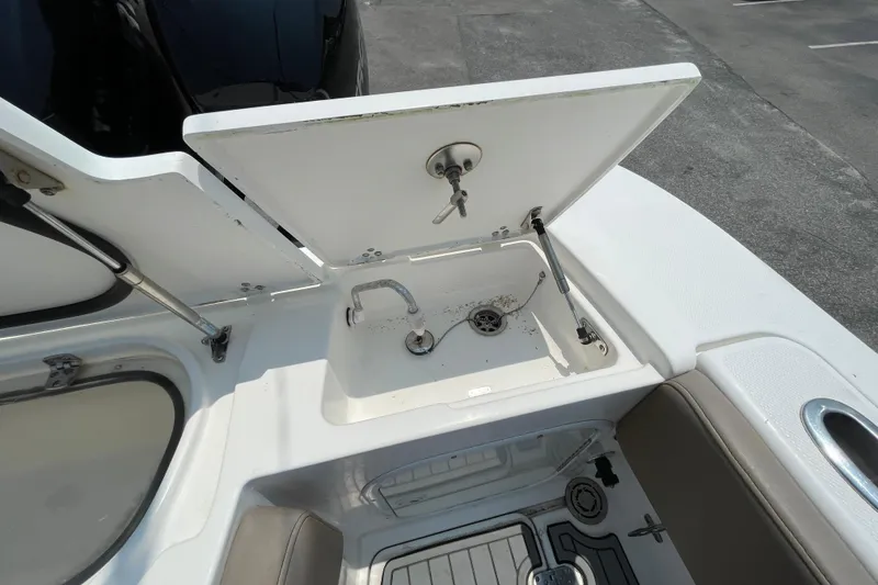Slide: The Image of 2007 Fountain 38 Sportfish Cruiser OB sink and storage compartment on deck. - 15