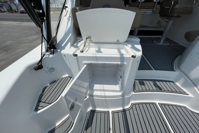 Slide: The Image of 2007 Fountain 38 Sportfish Cruiser OB interior with open storage compartment and seating area. - 17