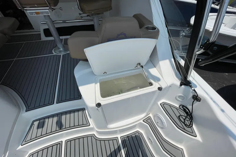 Slide: The Image of 2007 Fountain 38 Sportfish Cruiser OB interior with open storage compartment and seating. - 18