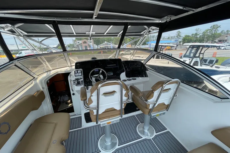 Slide: The Image of 2007 Fountain 38 Sportfish Cruiser OB cockpit with dual seats and navigation equipment. - 19