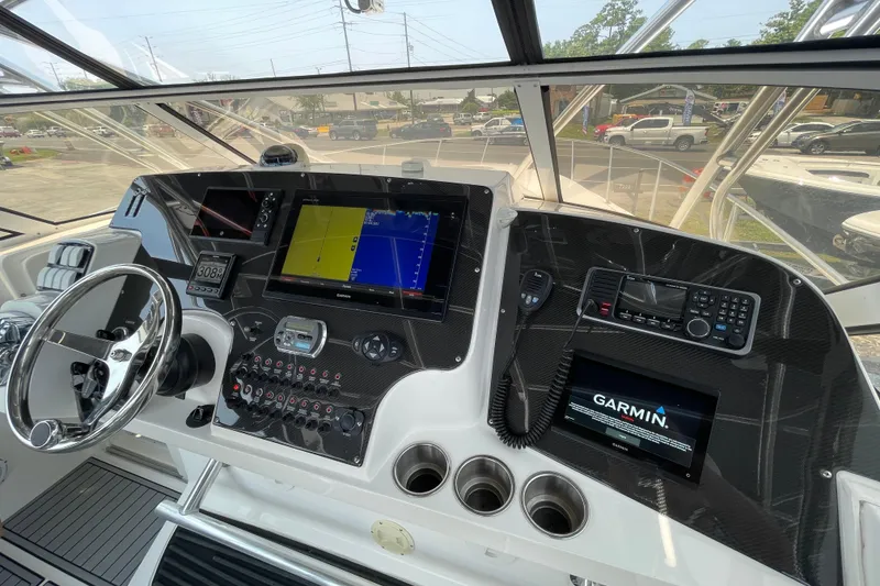 Slide: The Image of 2007 Fountain 38 Sportfish Cruiser OB helm with advanced navigation systems and controls. - 26