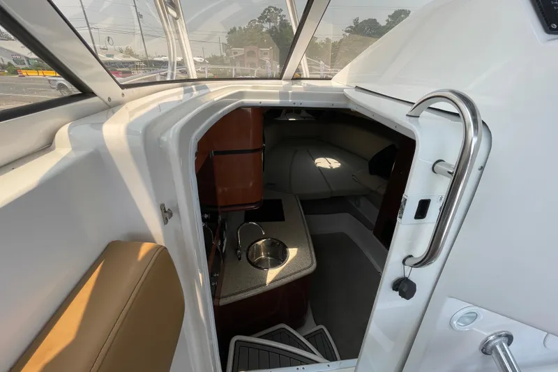Slide: The Image of 2007 Fountain 38 Sportfish Cruiser OB cabin interior with kitchenette and seating area. - 27