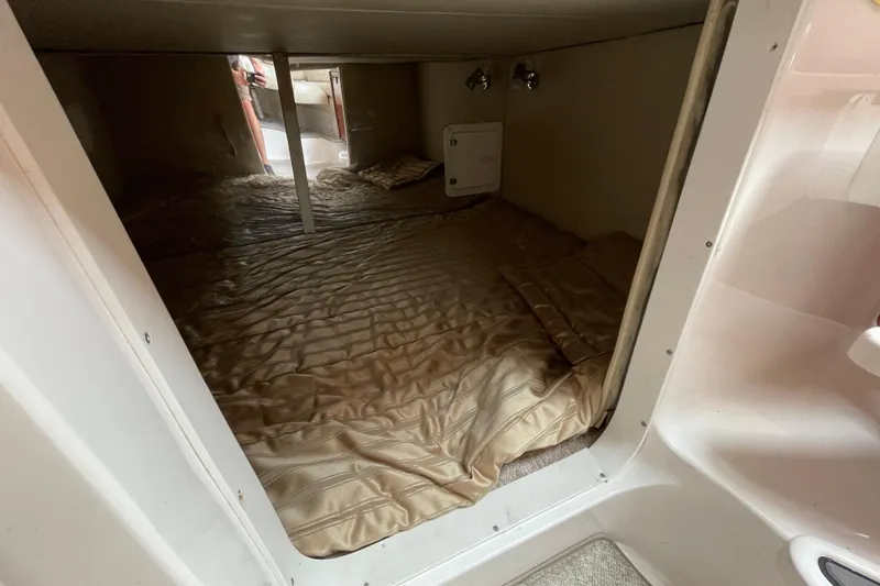 Slide: The Image of 2007 Fountain 38 Sportfish Cruiser OB cabin interior with bed and lighting. - 31