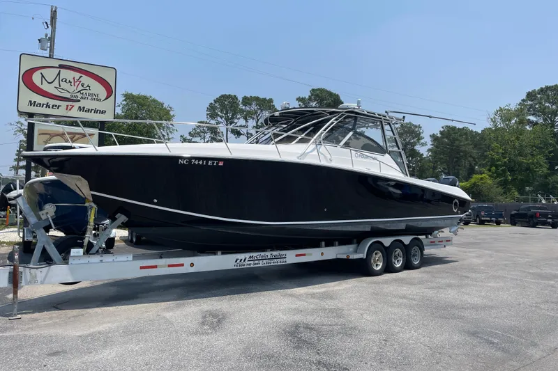 Slide: The Image of 2007 Fountain 38 Sportfish Cruiser OB on trailer at Marker 17 Marine dealership. - 35