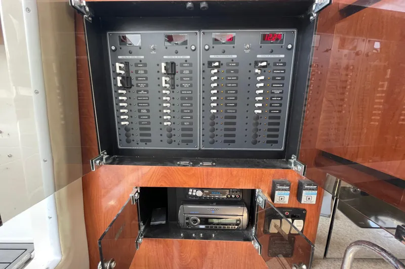 Slide: The Image of Electrical panel and audio system in 2007 Fountain 38 Sportfish Cruiser OB boat. - 40