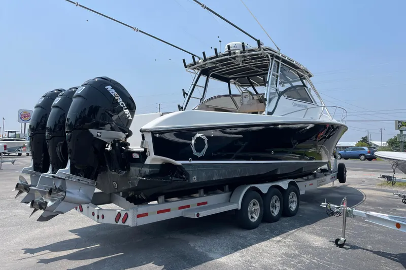 Slide: The Image of 2007 Fountain 38 Sportfish Cruiser OB on trailer with triple Mercury outboard engines. - 8