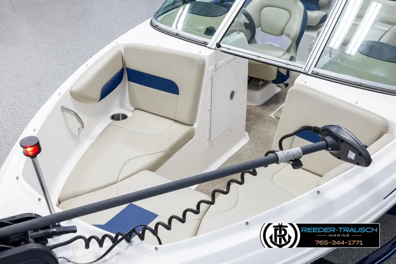 Slide: The Image of 2015 Chaparral 19 H2O Ski & Fish boat interior with seating and steering wheel. - 10
