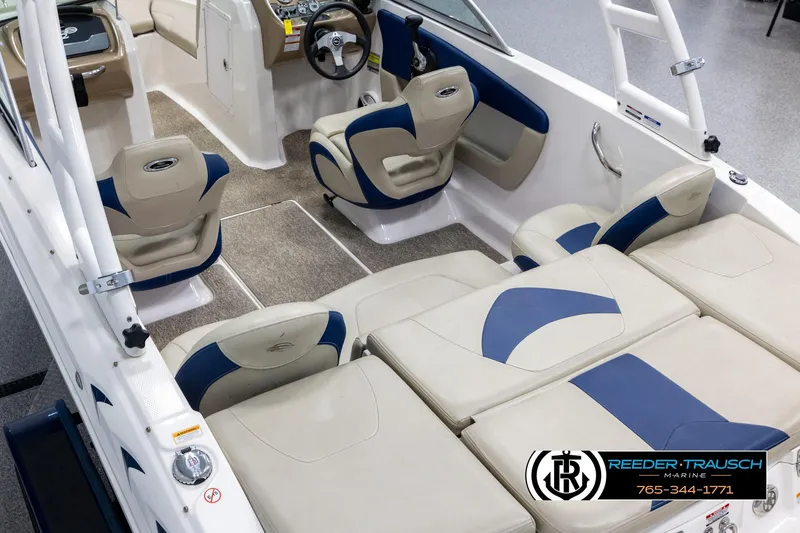 Slide: The Image of 2015 Chaparral 19 H2O Ski & Fish boat interior with beige and blue seating. - 11