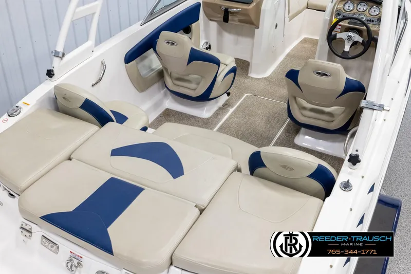 Slide: The Image of 2015 Chaparral 19 H2O Ski & Fish boat interior with beige and blue seating. - 12