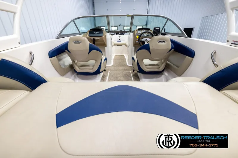 Slide: The Image of 2015 Chaparral 19 H2O Ski & Fish boat interior with blue and beige seating. - 13