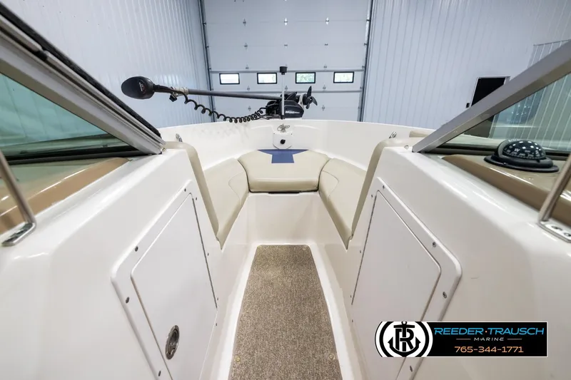 Slide: The Image of 2015 Chaparral 19 H2O Ski & Fish boat interior with seating and fishing equipment. - 15