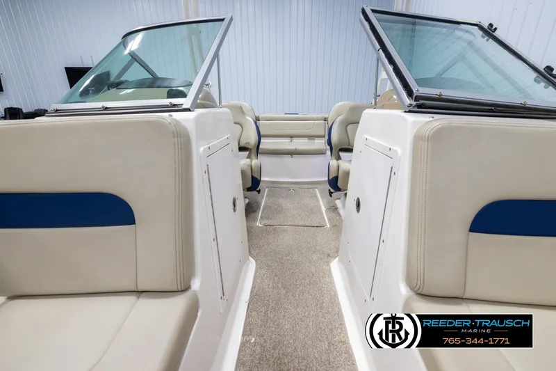 Slide: The Image of 2015 Chaparral 19 H2O Ski & Fish boat interior with beige and blue seating. - 16