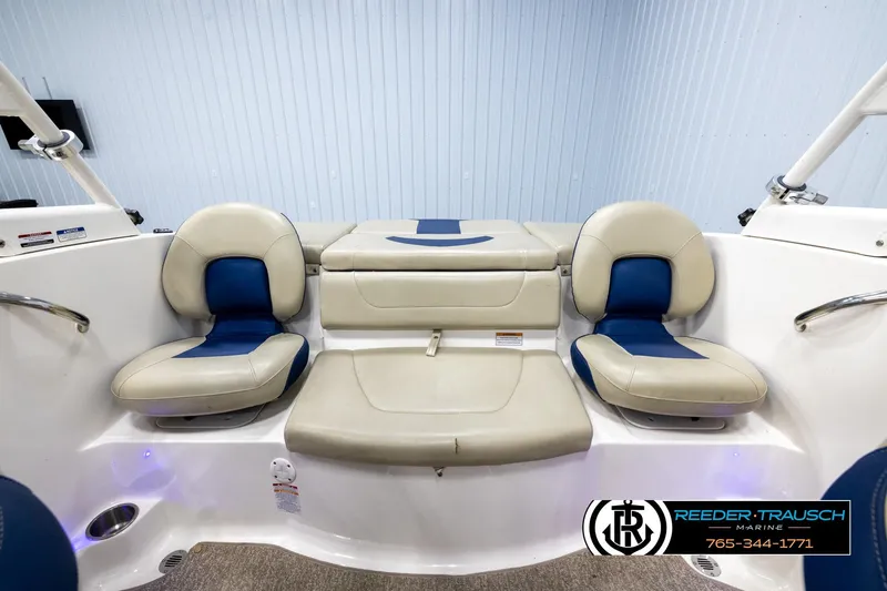 Slide: The Image of 2015 Chaparral 19 H2O Ski & Fish boat interior with beige and blue seating. - 18