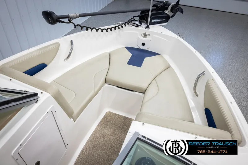 Slide: The Image of 2015 Chaparral 19 H2O Ski & Fish boat interior with cushioned seating and trolling motor. - 19