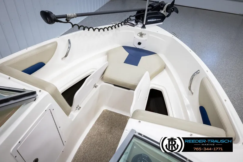 Slide: The Image of 2015 Chaparral 19 H2O Ski & Fish boat interior with storage compartments and seating. - 20