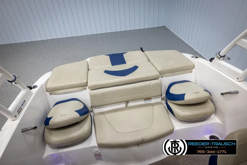 Slide: The Image of 2015 Chaparral 19 H2O Ski & Fish boat interior with beige and blue seating. - 22