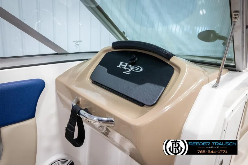 Slide: The Image of 2015 Chaparral 19 H2O Ski & Fish boat interior with H2O logo and blue seating. - 24