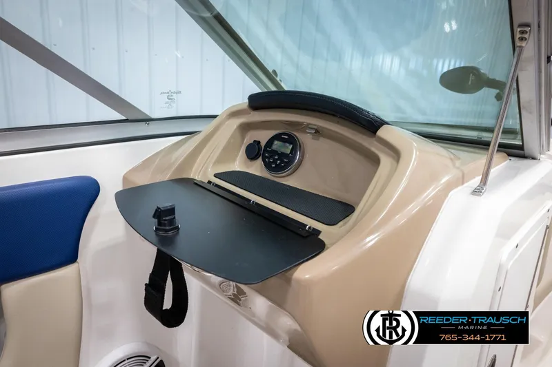 Slide: The Image of 2015 Chaparral 19 H2O Ski & Fish dashboard with storage and control panel. - 25