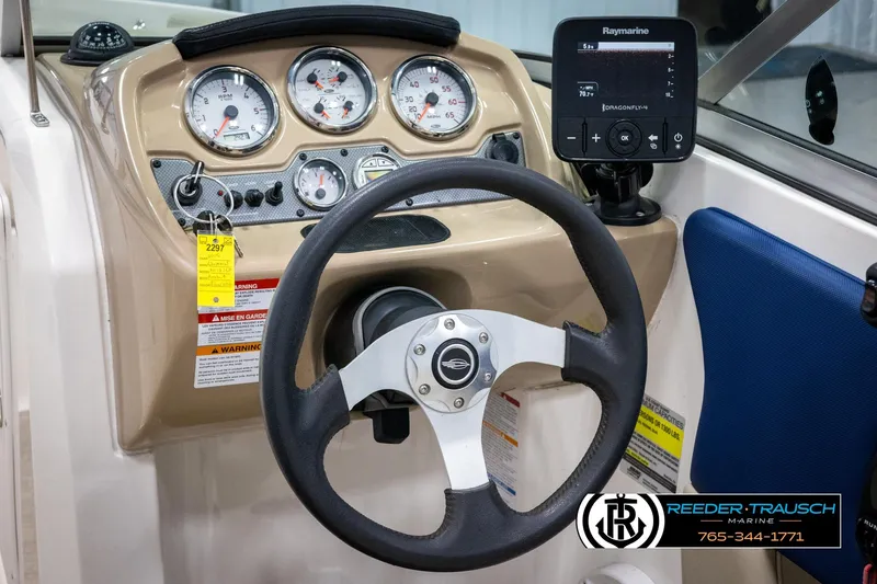 Slide: The Image of 2015 Chaparral 19 H2O Ski & Fish dashboard with steering wheel and gauges. - 27