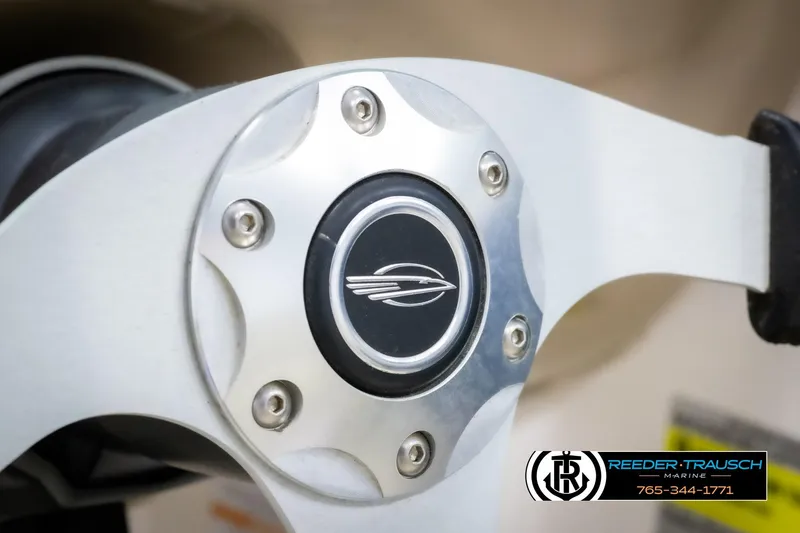 Slide: The Image of Steering wheel of 2015 Chaparral 19 H2O Ski & Fish boat, featuring sleek design. - 28