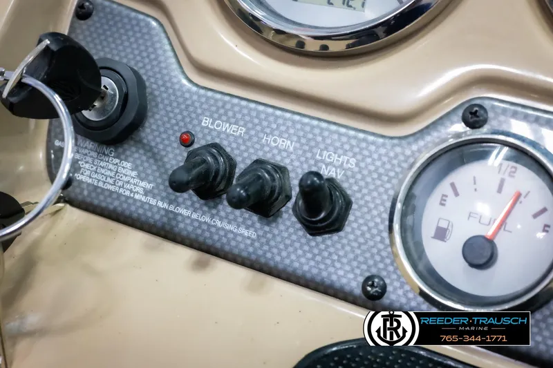 Slide: The Image of Control panel of 2015 Chaparral 19 H2O Ski & Fish boat with ignition and fuel gauge. - 30