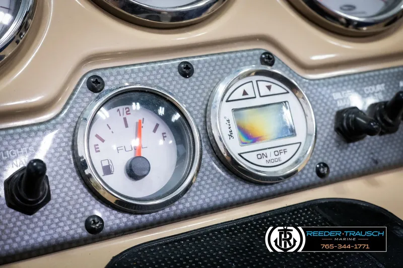 Slide: The Image of Dashboard of 2015 Chaparral 19 H2O Ski & Fish boat with fuel gauge and controls. - 32