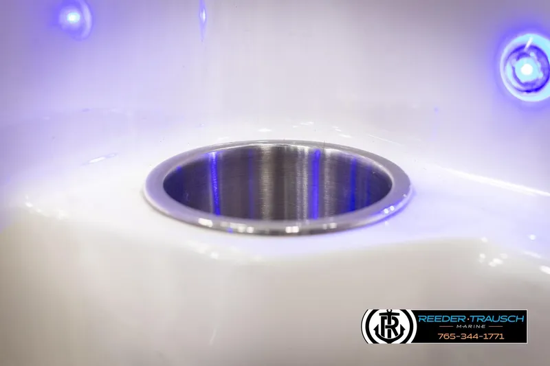 Slide: The Image of 2015 Chaparral 19 H2O Ski & Fish boat cup holder with blue LED lighting. - 40