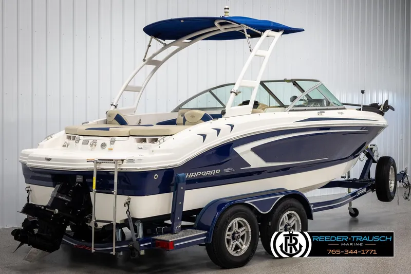 Slide: The Image of 2015 Chaparral 19 H2O Ski & Fish boat on trailer in showroom. - 6