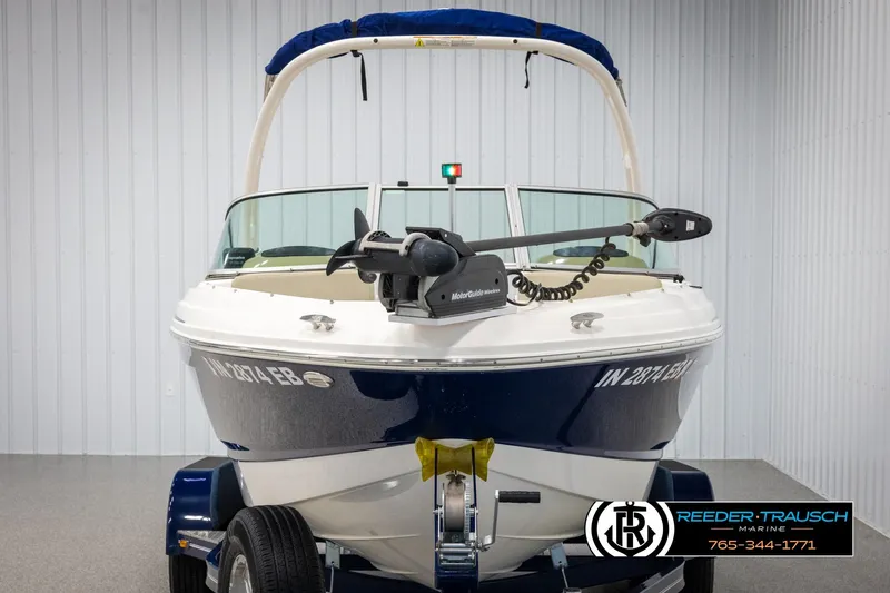 Slide: The Image of 2015 Chaparral 19 H2O Ski & Fish boat in showroom, front view with trailer. - 8