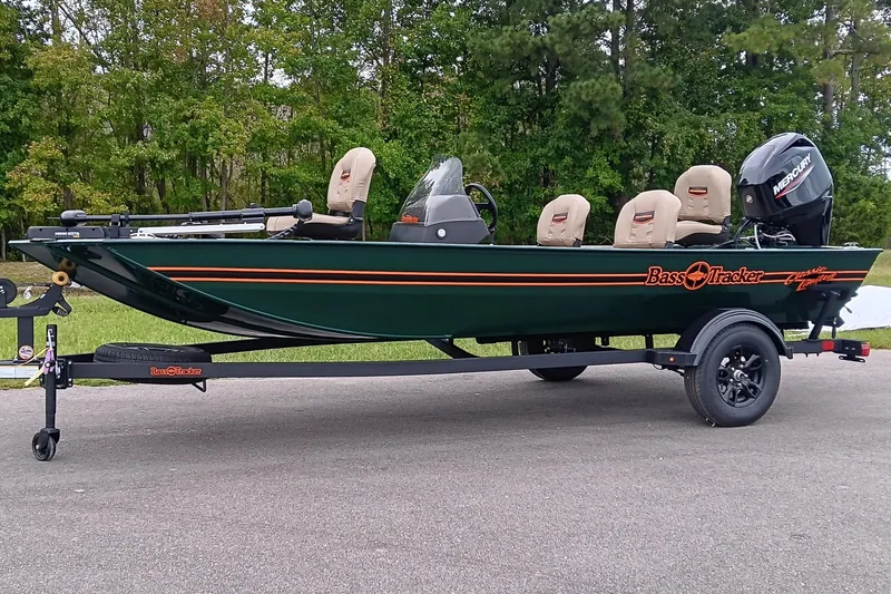 Slide: The Image of 2026 Tracker Bass Tracker Classic Limited boat on trailer, parked outdoors. - 2