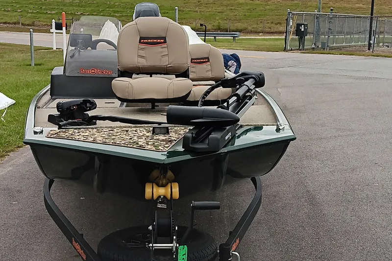 Slide: The Image of 2026 Tracker Bass Tracker Classic Limited boat on trailer, parked on paved road. - 6