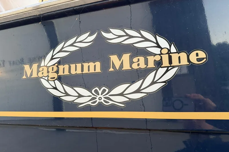 Slide: The Image of Magnum Marine logo on 1979 Magnum 38 Sport boat, featuring laurel wreath design. - 11
