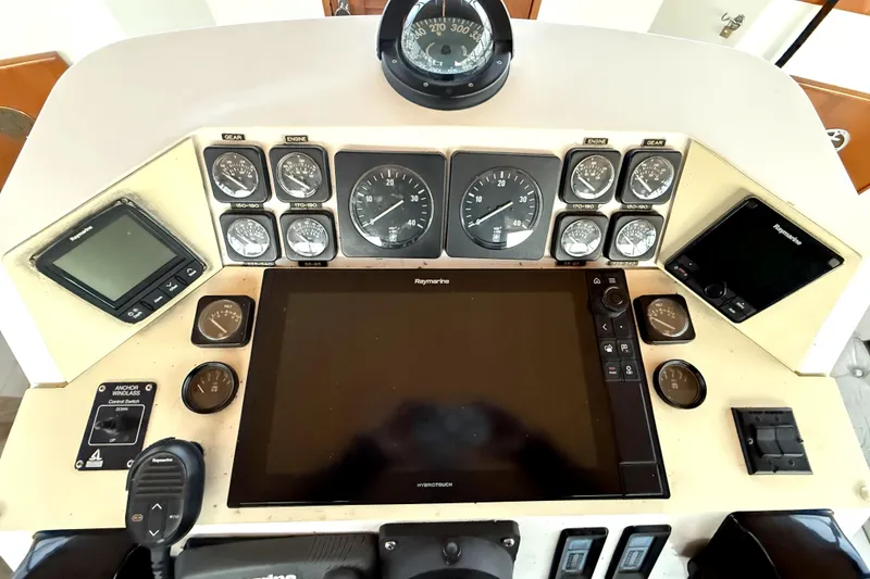 Slide: The Image of Control panel of a 1979 Magnum 38 Sport boat with gauges and navigation equipment. - 16