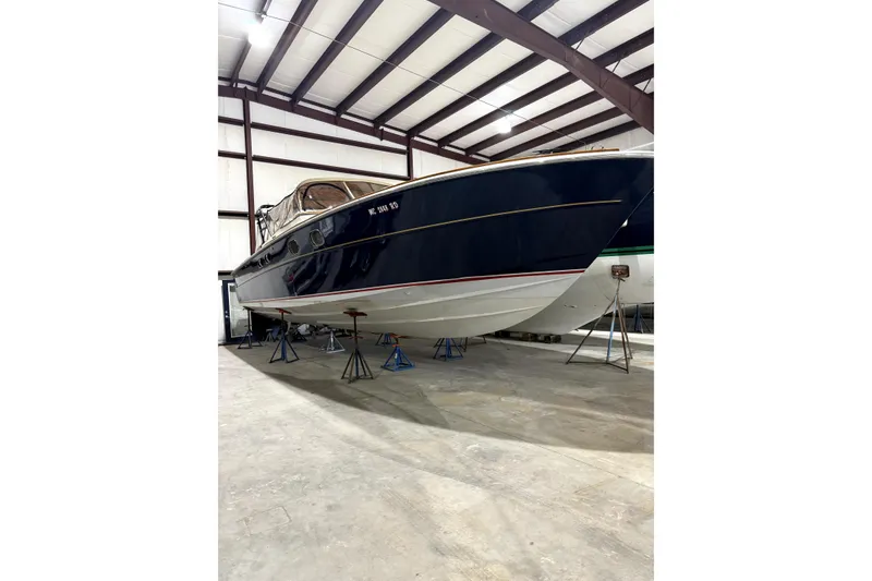 Slide: The Image of Framed 1999 Lakeland Boating magazine cover featuring Magnum 38 Sport, highlighting Lake Charlevoix. - 3