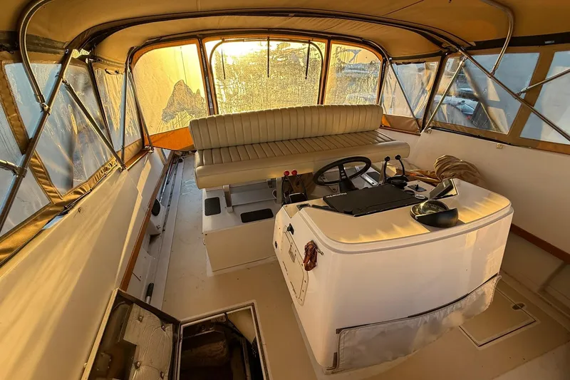 Slide: The Image of Interior of a 1979 Magnum 38 Sport boat with helm and seating area. - 43