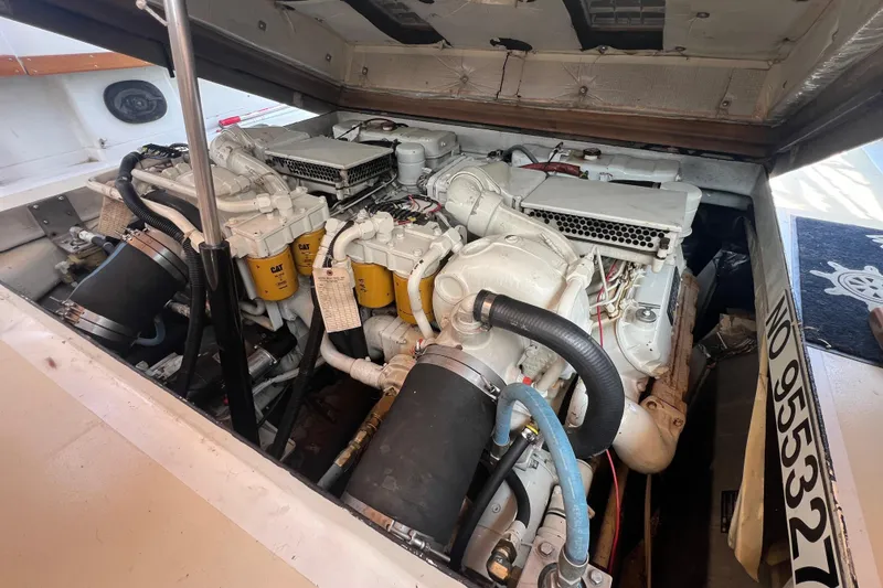 Slide: The Image of Engine compartment of a 1979 Magnum 38 Sport boat, showcasing dual engines. - 47