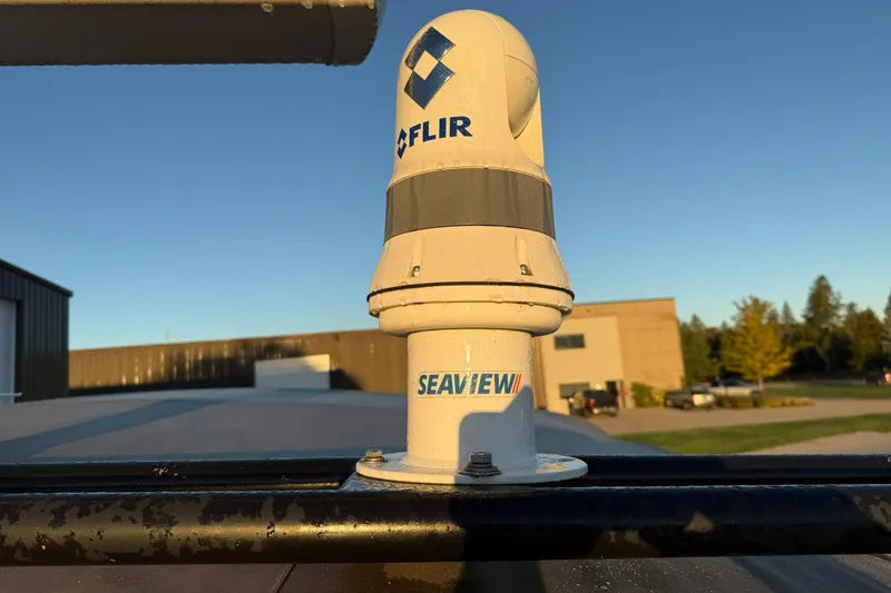 Slide: The Image of FLIR camera on Magnum 38 Sport, 1979, with Seaview mount in sunny outdoor setting. - 48