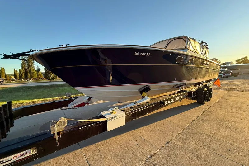 Slide: The Image of 1979 Magnum 38 Sport boat on trailer at sunset, Boyne Boat Yard. - 53