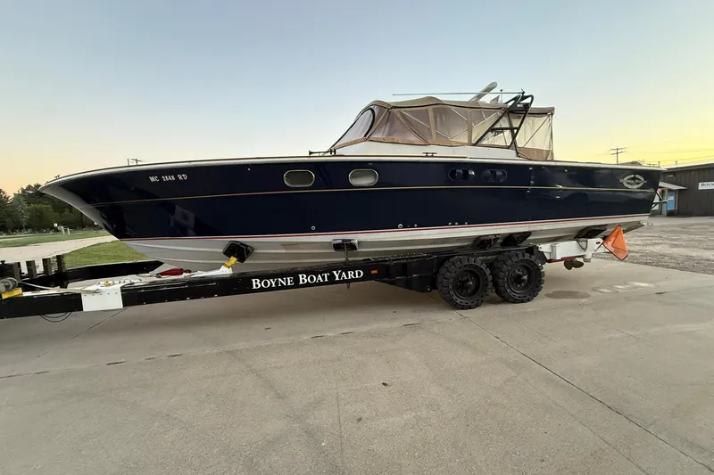 Slide: The Image of 1979 Magnum 38 Sport boat on trailer at Boyne Boat Yard. - 55