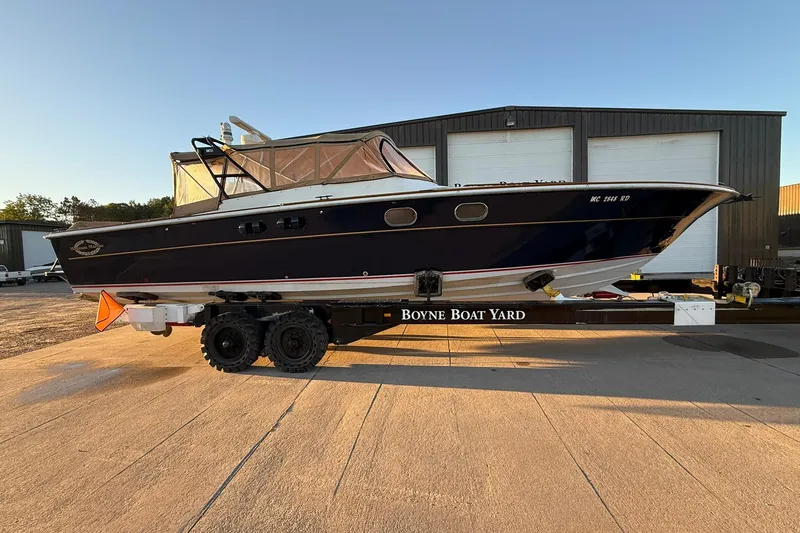 Slide: The Image of 1979 Magnum 38 Sport boat on trailer at Boyne Boat Yard. - 57