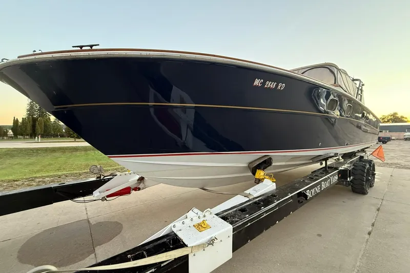 Slide: The Image of 1979 Magnum 38 Sport boat on trailer at Boyne Boat Yard during sunset. - 8