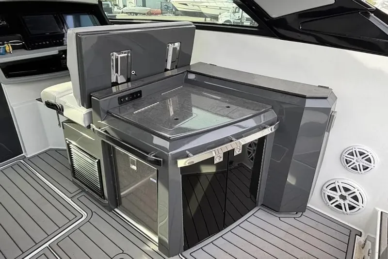 Slide: The Image of 2019 Cobalt A36 boat interior with sleek kitchenette and modern appliances. - 14