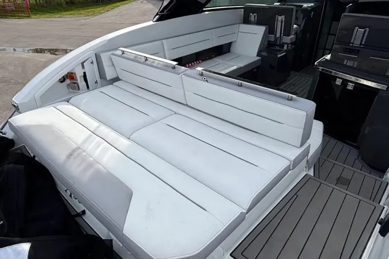 Slide: The Image of 2019 Cobalt A36 boat interior with white seating and sleek design. - 17